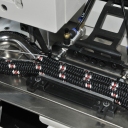 Máquina electrónica para coser cuerdas